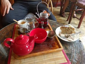 Red teapot: Rukeri tea; glass teapot: hibiscus tea; dessert: Earl Grey and lemon cake at Tea Sutra Teahouse in Newcastle Upon Tyne