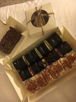 Sushi rolls set , Chocolate basil cake and a bunch of sweets  at Nebos in Kyiv