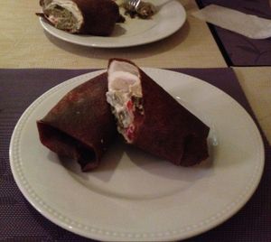 Burrito with falafel and cherry tomatoes at Nebos in Kyiv