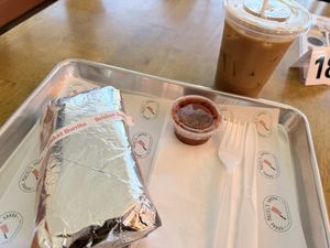 Brisket burrito and maple cinnamon cold brew   at Maciel's Plant-Based Butcher & Deli in Los Angeles