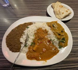 Coconut curried lentils, chickpea bebere stew, and tofu curry- with rice and roti  at Jambo Cafe in Santa Fe