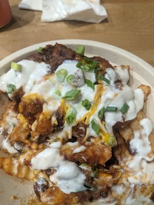 Chilli Chz Fries half devoured. at Next Level Burger - West Burnside in Portland