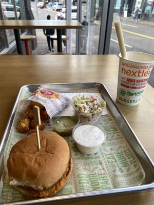 Vegan Buffalo Chick’n, Tots, Orange Cream Shake 😛  at Next Level Burger - West Burnside in Portland