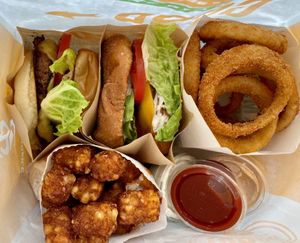 Burgers, tots, and onion rings    at Next Level Burger - West Burnside in Portland