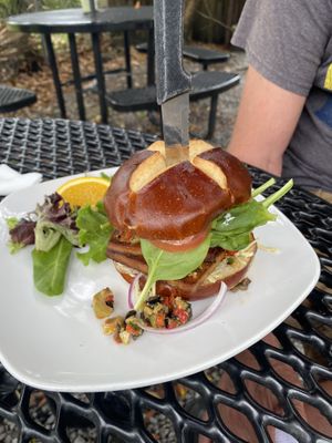 Muffuletta sandwich with pretzel bun  at End of the Line Cafe in Pensacola