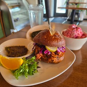 Jackfruit pulled pork Sammy, pink potatoe salad, Dolma & Falafel at End of the Line Cafe in Pensacola