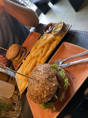 We ordered a burger each and a pound of chips to share. You get to choose dressings for your chips. We had one BBQ and one basil mayo. Both vegan. The basil mayo was amazing.   at Peter Pane - Neue Promenade in Berlin