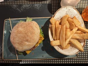 Hüttenzauber Burger menu with fries.  at Peter Pane - Neue Promenade in Berlin