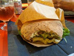the vegan sandwich and a can of red spritz at Ribelle in Assisi