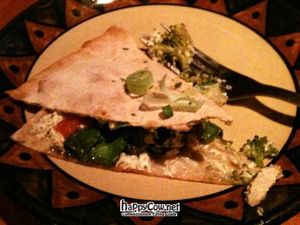 A piece of the veggie quesadilla with tofu cream. *Bad phone camera at Calactus Cafe in Moncton