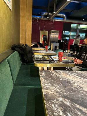 Kitchen in background   at Saravanaa Bhavan in Cologne