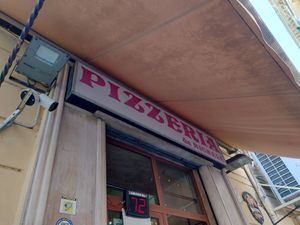 The number on the display is for sitting, on the right side of it is the line to take away! at Pizzeria da Michele in Naples