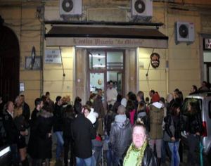 People waiting to get in to Pizzeria da Michele. at Pizzeria da Michele in Naples