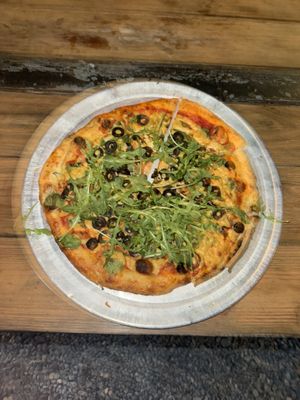 CYO pizza: traditional dough, tomato sauce, vegan cheese, black olives, spinach, fresh basil, arugulaa  at Magdalenes Pizza in Aguadilla