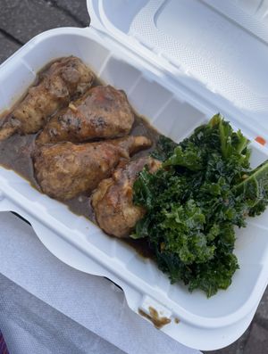 Jerk chicken drummies and kale salad   at Zoe's Vegan Delight  in Washington