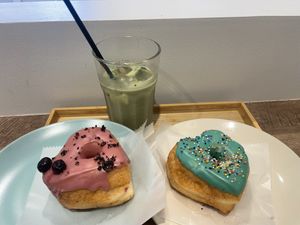 Two donuts with jam filling, and matcha latte  at Trick or Treat Vegan Sweets (formerly Canelita Sweets) in Osaka