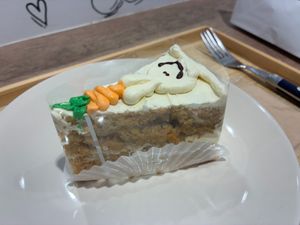Enjoying my slice of carrot cake upstairs at Trick or Treat Vegan Sweets (formerly Canelita Sweets) in Osaka