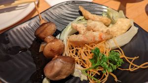 Teriyaki mushroom skewer on the left, salt & pepper vegan shrimp on the right at OPLANTE Vegan Sushi & Wok  in Montreal