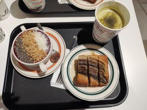 Berry smoothie bowl, banana bread, and matcha latte with oat milk - all vegan at Caffeinated in Busan