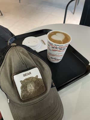 Latte hot oat milk add 1 shot  at Caffeinated in Busan