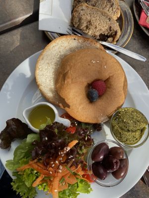 Bagel with pesto instead of hummus and marzipan Guglhupf cake   at Cafe Guglhupf in Munich