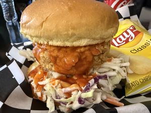 “Chicken” sandwich with buffalo sauce and cole slaw salad 🤩  at Not Ya Mama's Vegan Cafe in Salem