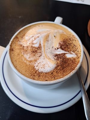 Cappuccino with oat milk at Combi Coffee Roasters in Porto