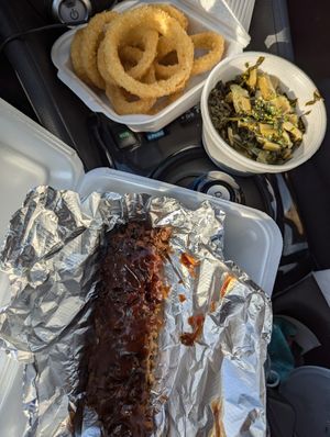 BBQ Ribs, onion rings, collard greens at The Soulful Vegan in Akron
