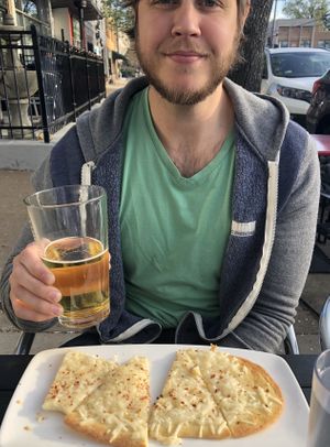 Friday happy hour- $3 Kona longboards and $5 vegan pizza at Frida's in University City