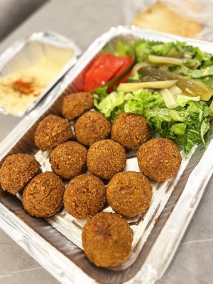 Delivered falafel plate with fresh veggie and pickles at Falafel Al Darwandy in Yerevan