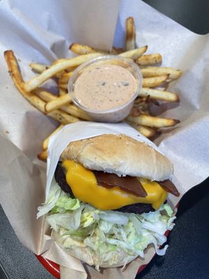 Bacon cheeseburger, fries, and a side of house special sauce!  at Juicy J's Smoked Burgers in Poulsbo
