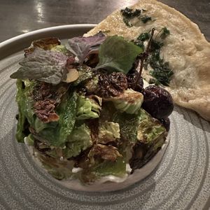 Grapes (cashew yogurt, brussels sprout leaves )  at Hawker in Toronto
