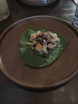 Perilla leaf with smoked cabbage, pickled mushroom, beet reduction, chili cream, pistachio at Hawker in Toronto