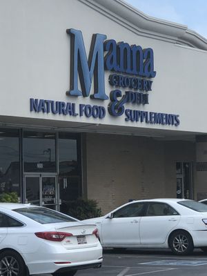 Located at the end of a strip mall. at Manna Grocery and Deli in Tuscaloosa