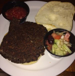 the bean burger with salsa and mediterranean medley side dish at Mr Bones BBQ in Holmes Beach