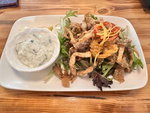 Oyster mushroom calamari.  Portion was small, there was a lot of lettuce (no dressing) under some very thin flattened mushrooms. Tasty, but small, not “filling” portion.   at Brie & Barrel in Port Alberni