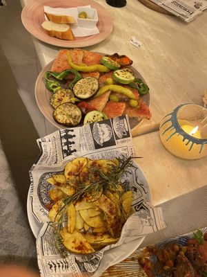 Pa amb oli bread with grilled veg and rosemary potatoes. Olives and bread in the background.  at Cristal in Mallorca