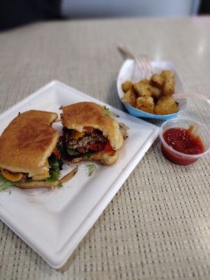 Breakfast just egg sandwich and tater tots. at Rock N Roll Donut Bar in Monterey