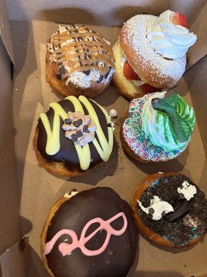 Samosa, strawberry shortcake, mermaid?, chocolate everything, Boston cream and Cookie Monster   at Rock N Roll Donut Bar in Monterey