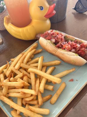 Vegan hotdog and “the ducks” cocktail  at Sapori in Mallorca