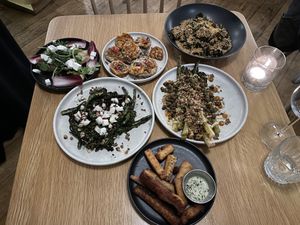 From top left— artichoke hearts, fried mushrooms caps, Brussels sprouts, charred broccolini, asparagus, and polenta fries  at Conceria in Montreal