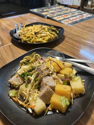 Mixed pea tofu spicy salad (front) and yellow noodles (back)  at Pa Yod Shan Vegetarian Cafe in Chiang Mai