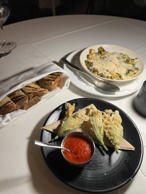 Zucchini blossoms, and Mushroom Scallop with a side of bread   at Crossroads Kitchen in Las Vegas