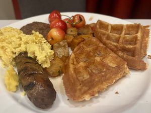 Sunday brunch breakfast potatoes, waffles, sausage, scrambled eggs and cherries   at Crossroads Kitchen in Las Vegas