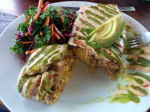 Super Vegano Burrito. Delicious pepper kale tofu, sausage, hash browns, mozzarella, avocado, cashew cream. Salad - kale, red cabbage, carrots in a citrusy dressing. So good & filling.  at A N D Cafe in Portland