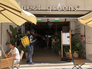 Front of restaurant on busy pedestrian street  at Honest Greens in Porto