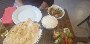 Sizzling mushrooms, okra curry? Vegan garlic naan and rice. at Surabhi in Manchester