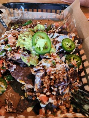 Half eaten second order of nachos.  Had to take the picture fast before it was gone! at JDs VegMex in Miami