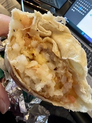 Egg, chz, potato burrito. Bad pic; good taste. 😋   at elephant+vine in Chicago