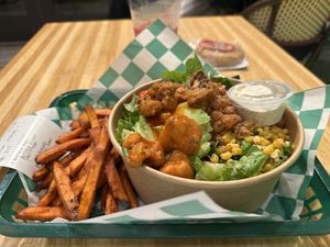 Buffalo cauliflower salad with sweet potato fries  at elephant+vine in Chicago